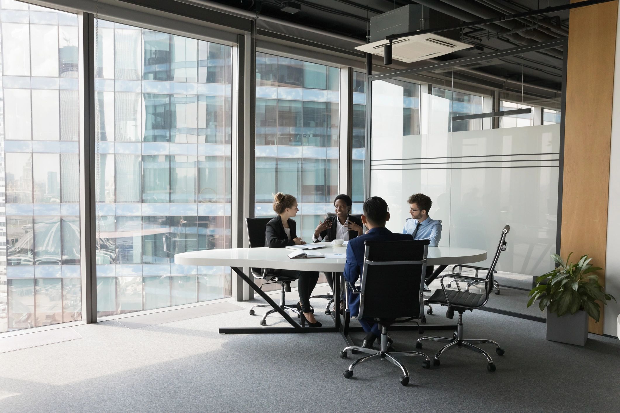 Business team in discussion representing client partnerships